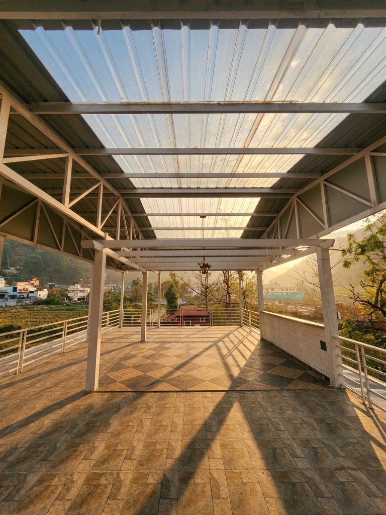 Open terrace with transparent roof and mountain view at golden hour