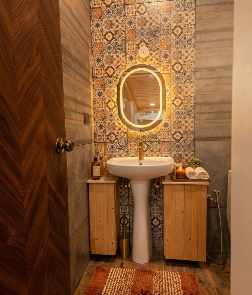 Mosaic-tiled bathroom with back-lit mirror